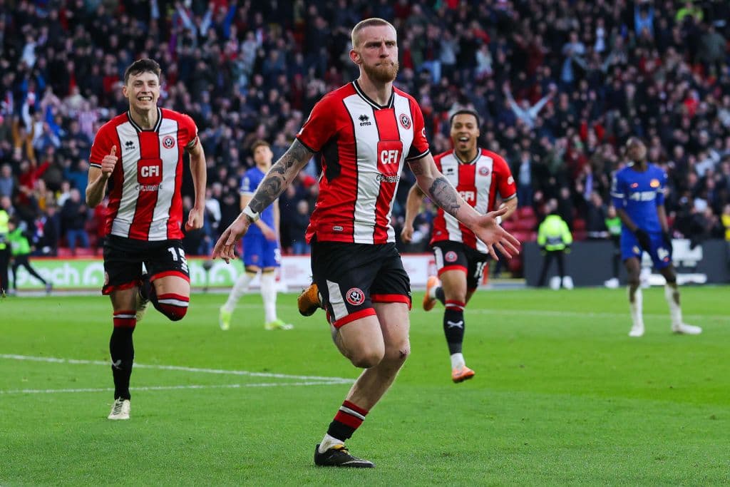 Oliver McBurnie of Sheffield United celebrates after scoring his side's second goal in stoppage time during the Premier League match between Sheffield United and Chelsea FC