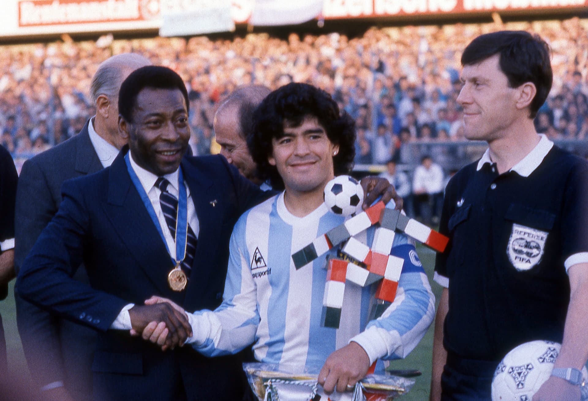 Pelé of Brazil shankes hands with Diego Maradona of Argentina