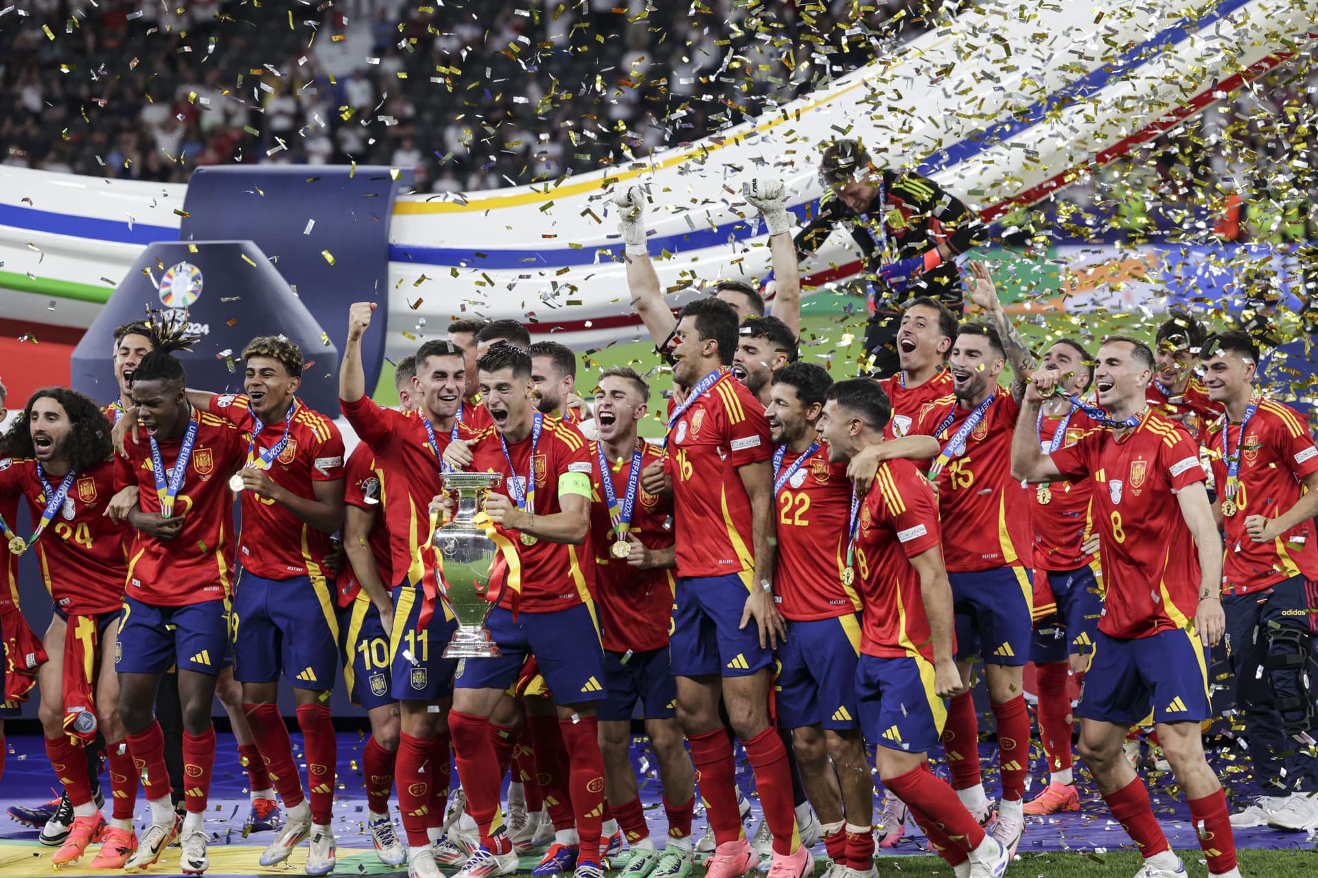 Players of Spain celebrate with the trophy during a ceremony after winning against England at the UEFA EURO 2024