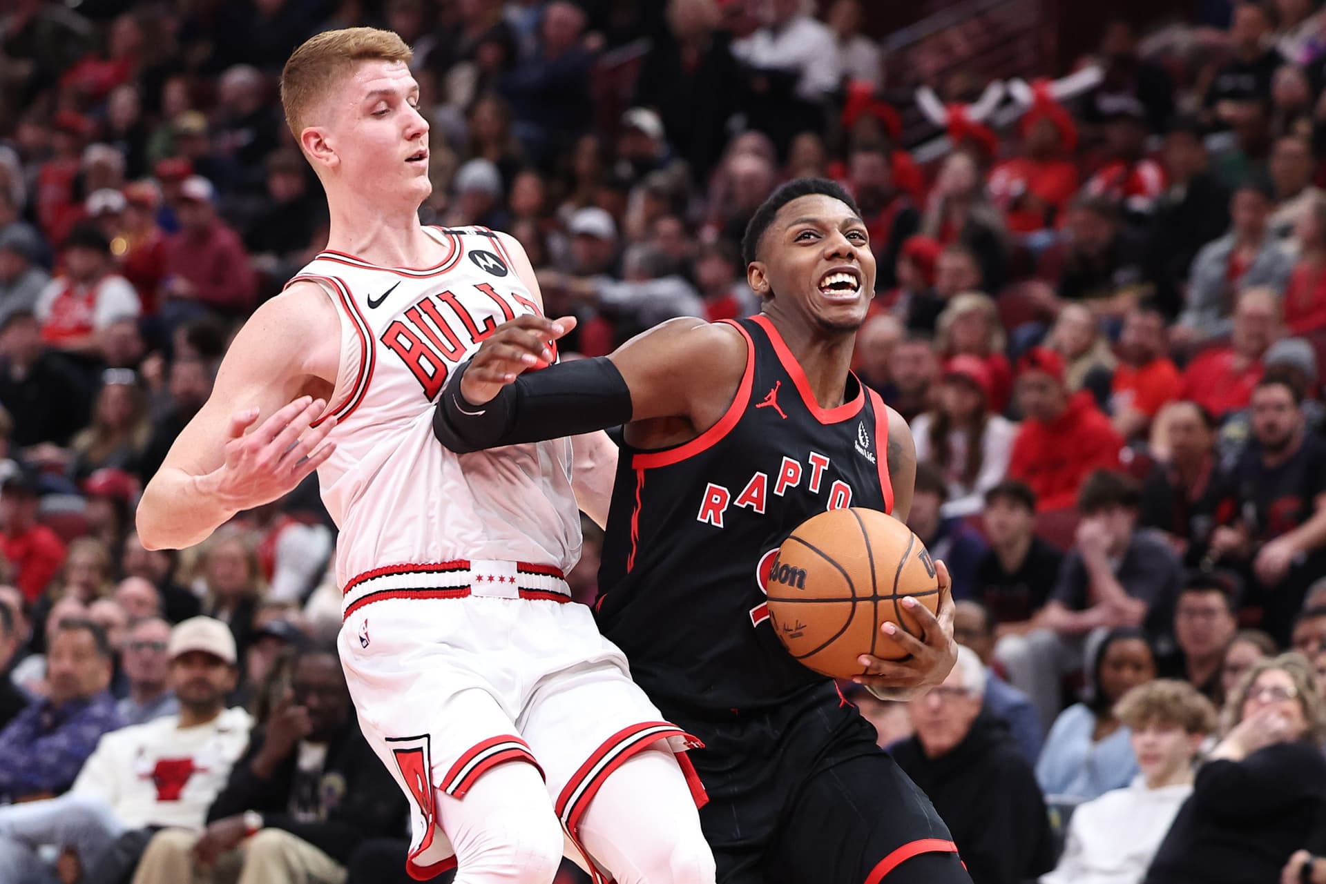 RJ Barrett dribbles past Kevin Huerter.jpg