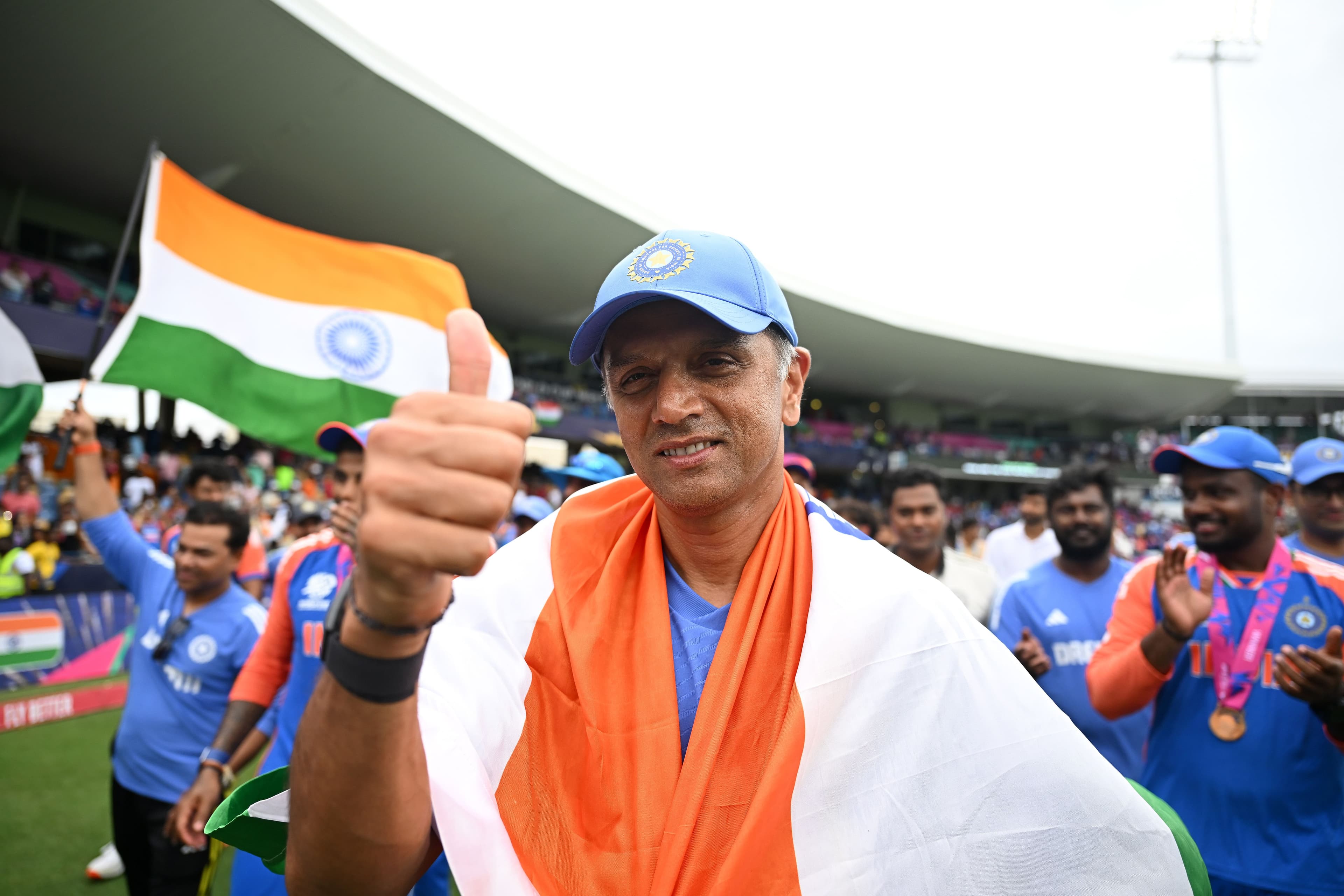 Rahul Dravid Head Coach of India celebrates with a flag of India
