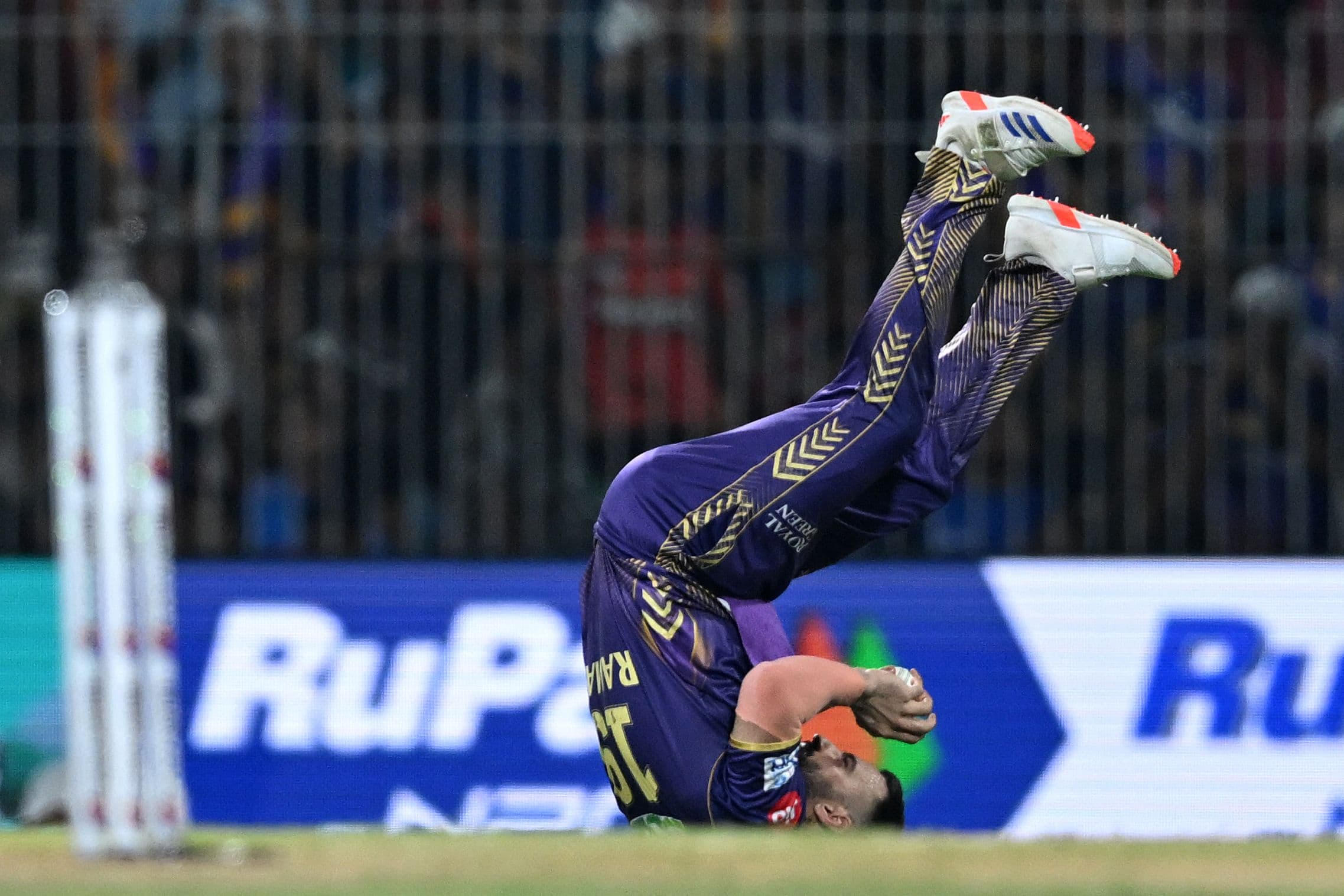 Ramandeep Singh takes the catch to dismiss Rahul Tripathi