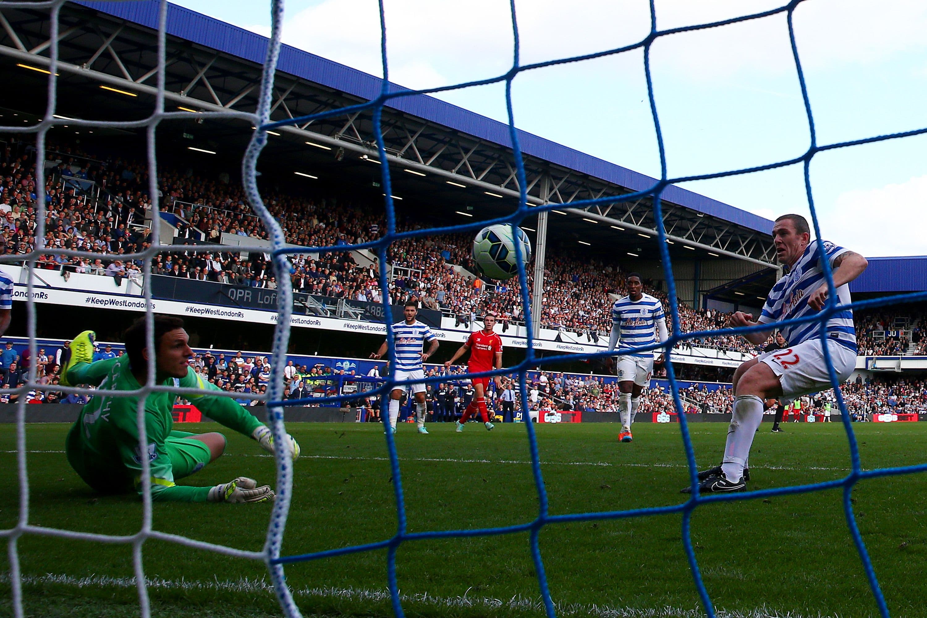 Richard Dunne of QPR scores an own goal past Alex McCarthy