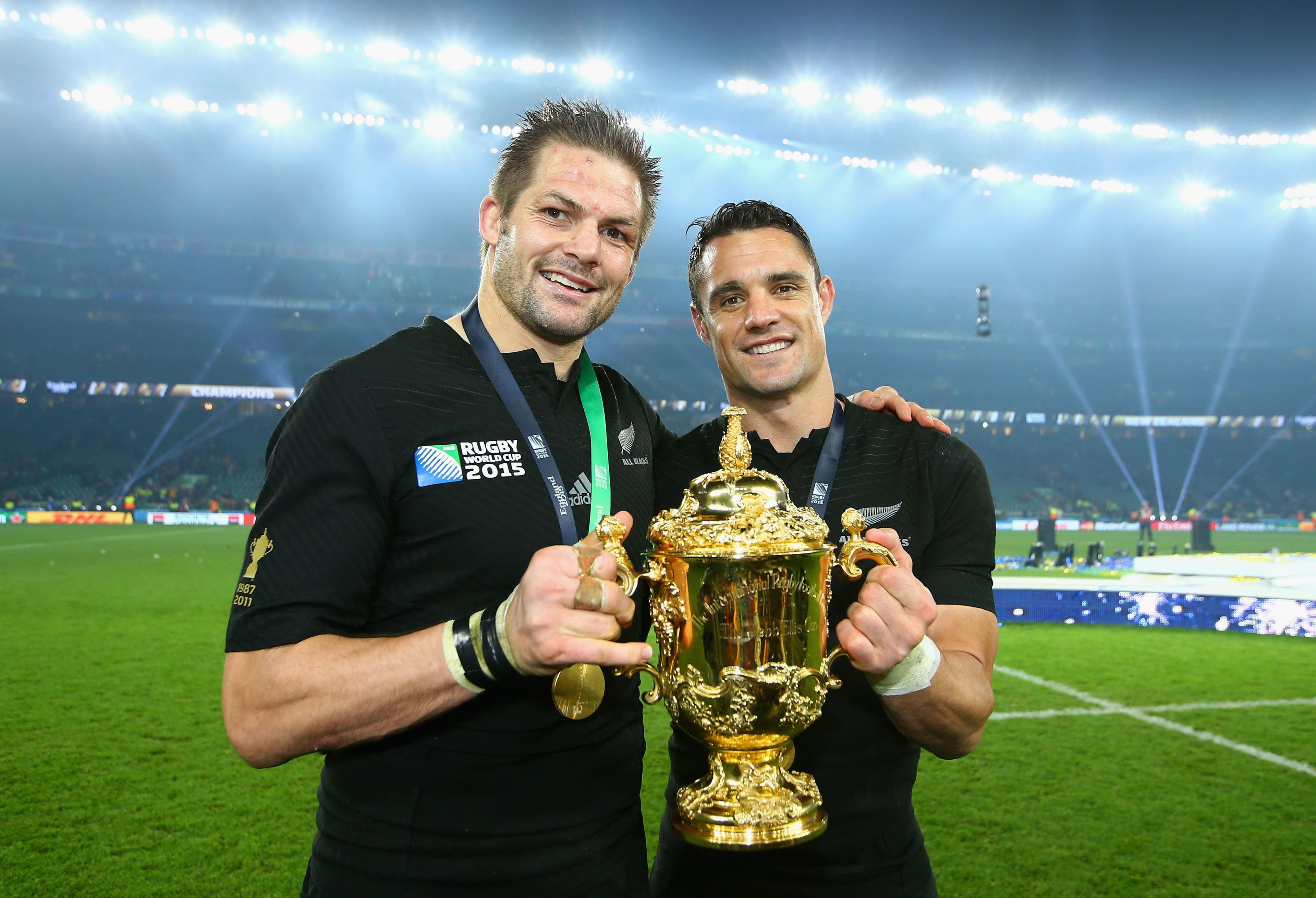 Richie McCaw and Dan Carter of the New Zealand All Blacks poses with the Webb Ellis Cup