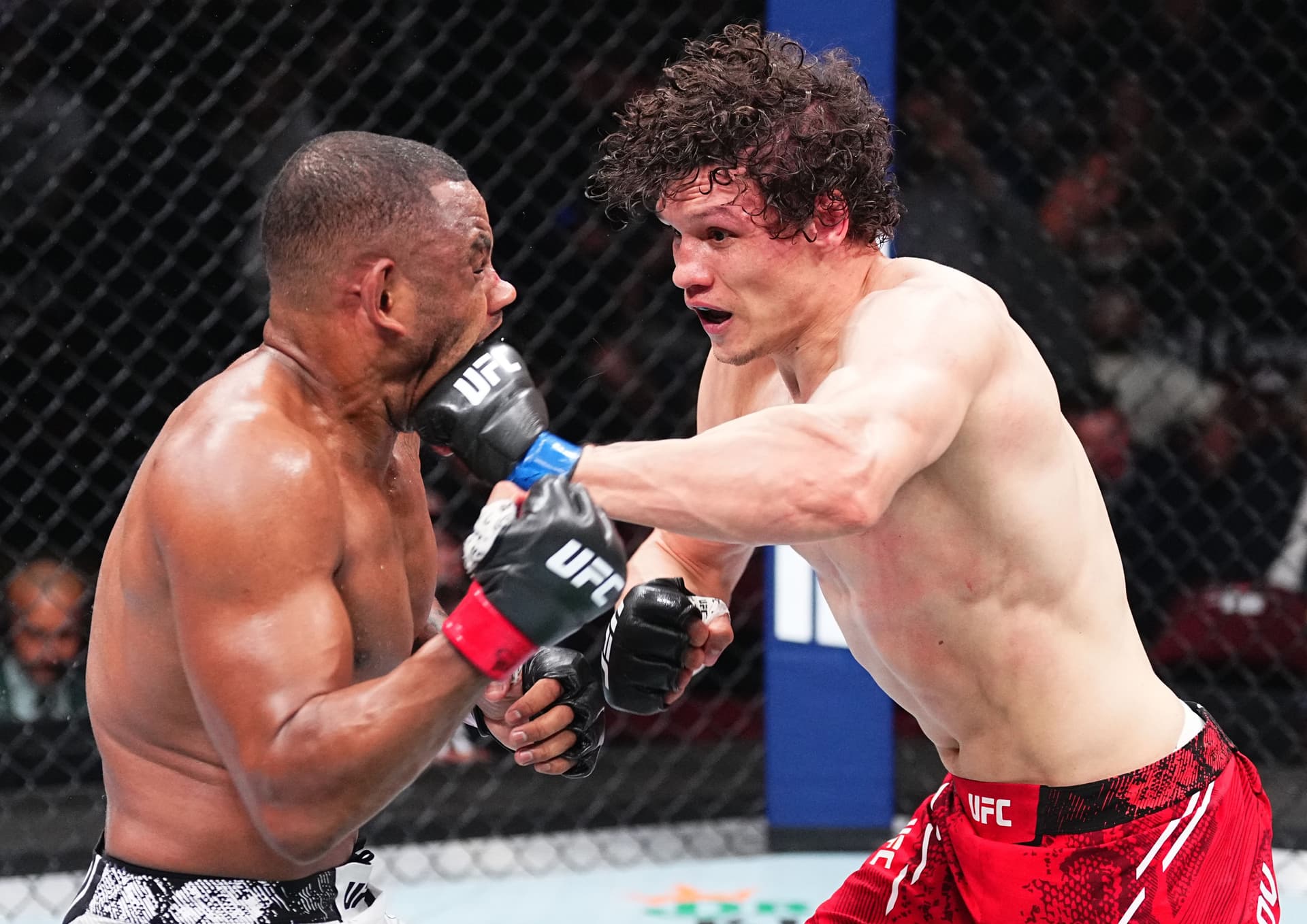 Roman Kopylov of Russia punches Cesar Almeida of Brazil