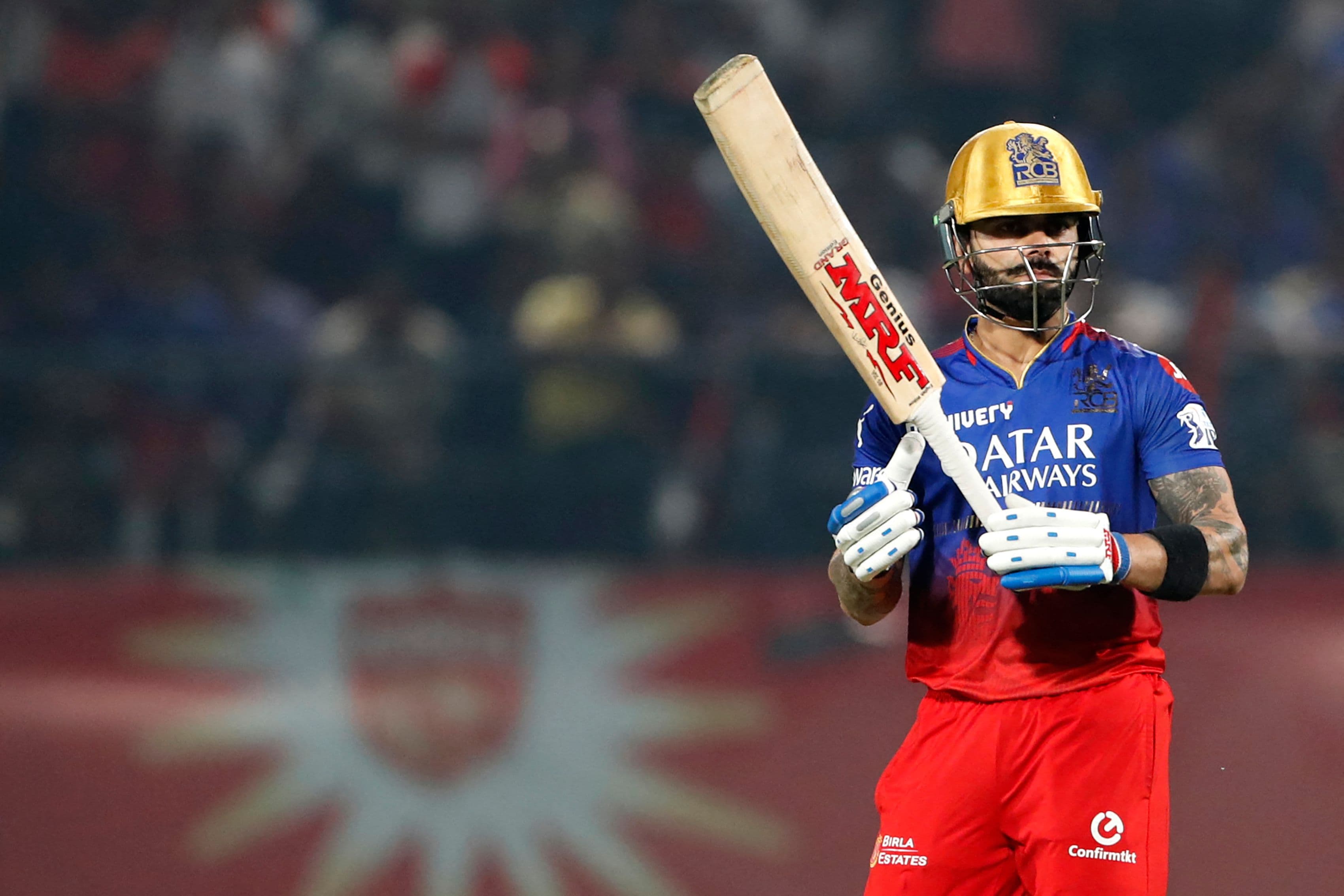RCB's Virat Kohli watches the ball after playing a shot