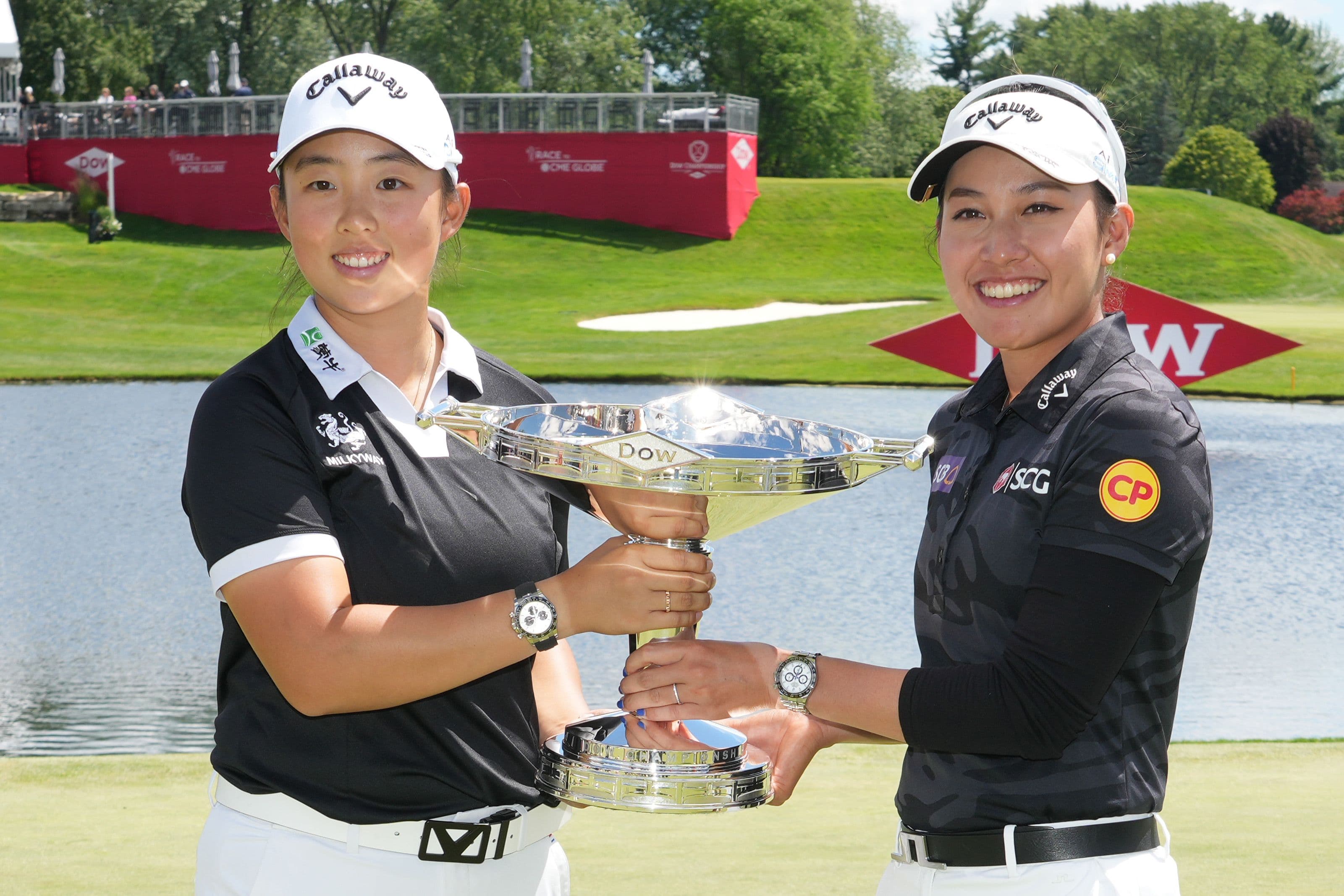 Ruoning Yin and Atthaya Thitikul with the trophy after winning the Dow Championship