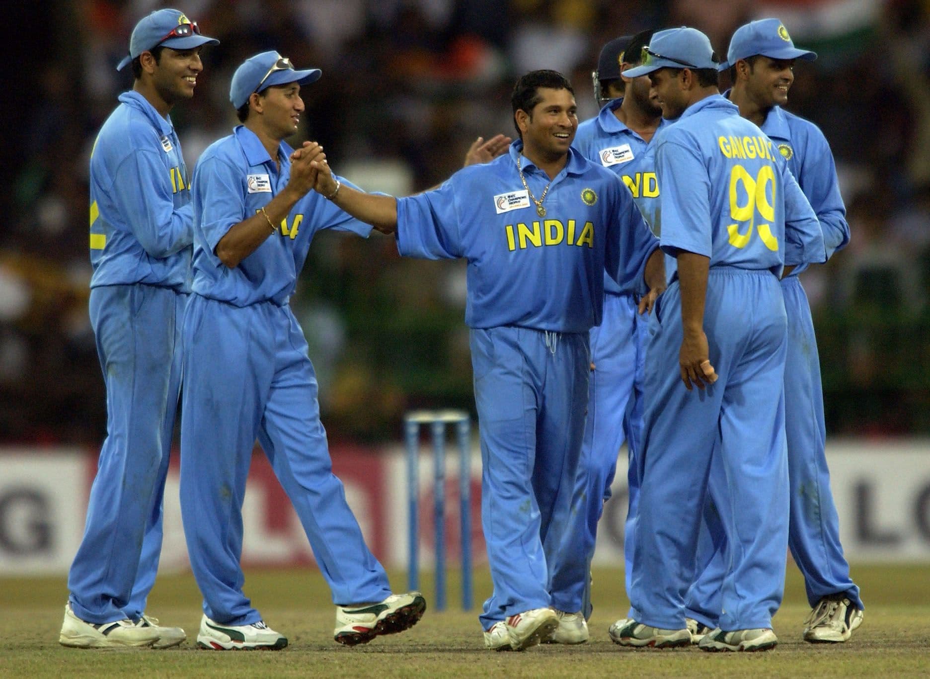 Sachin Tendulkar is congratulated by teammates after taking the wicket of Mahela Jayawardene