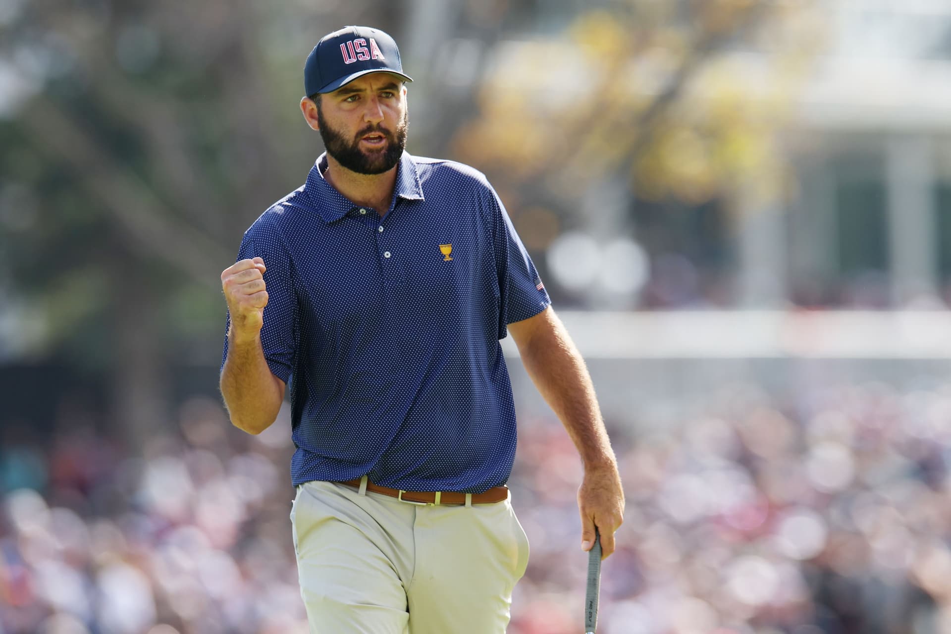 Scottie Scheffler of the U.S. Team celebrates on the 17th green during Saturday Morning