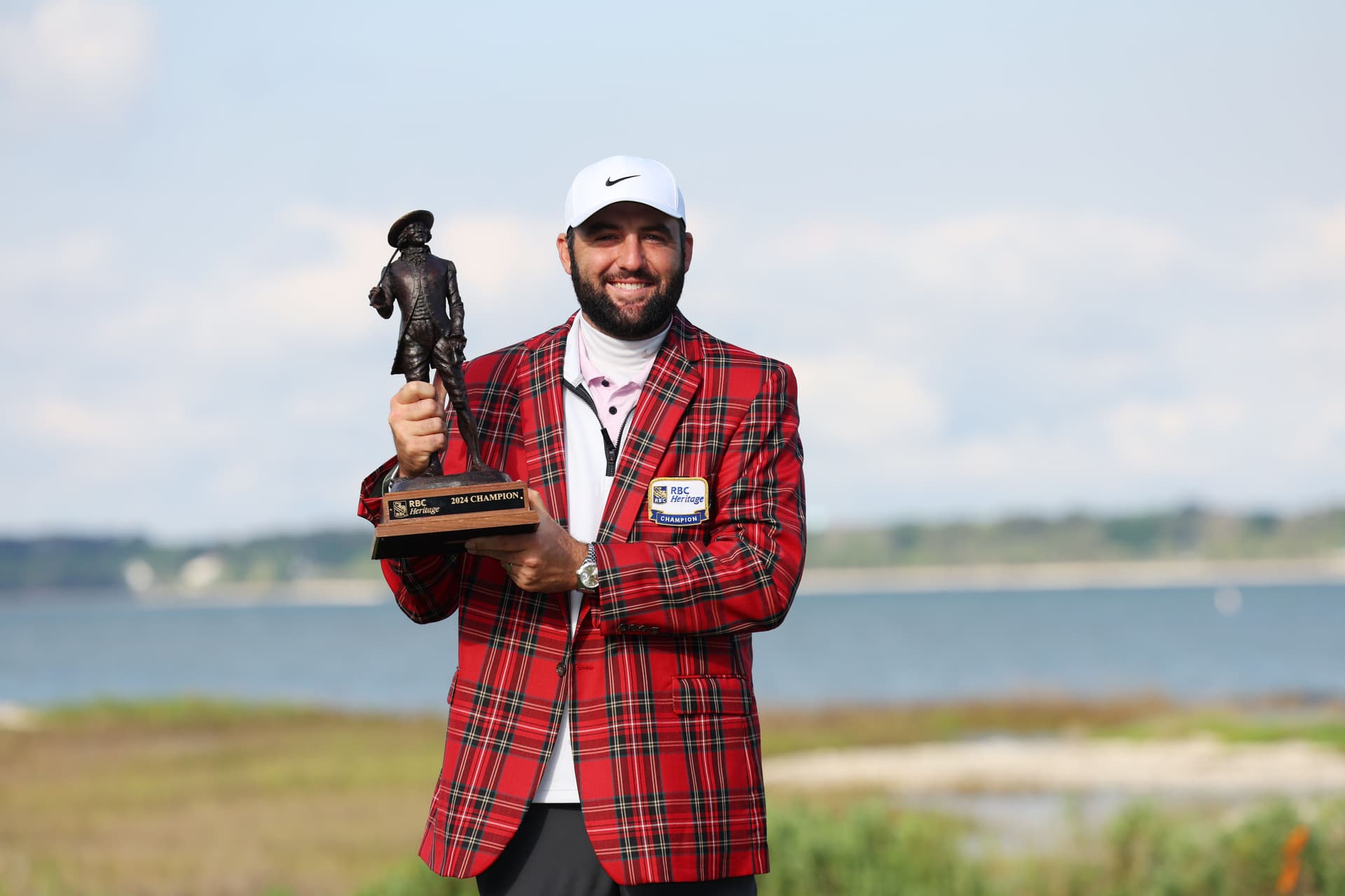Scottie Scheffler of the United States celebrates with the trophy