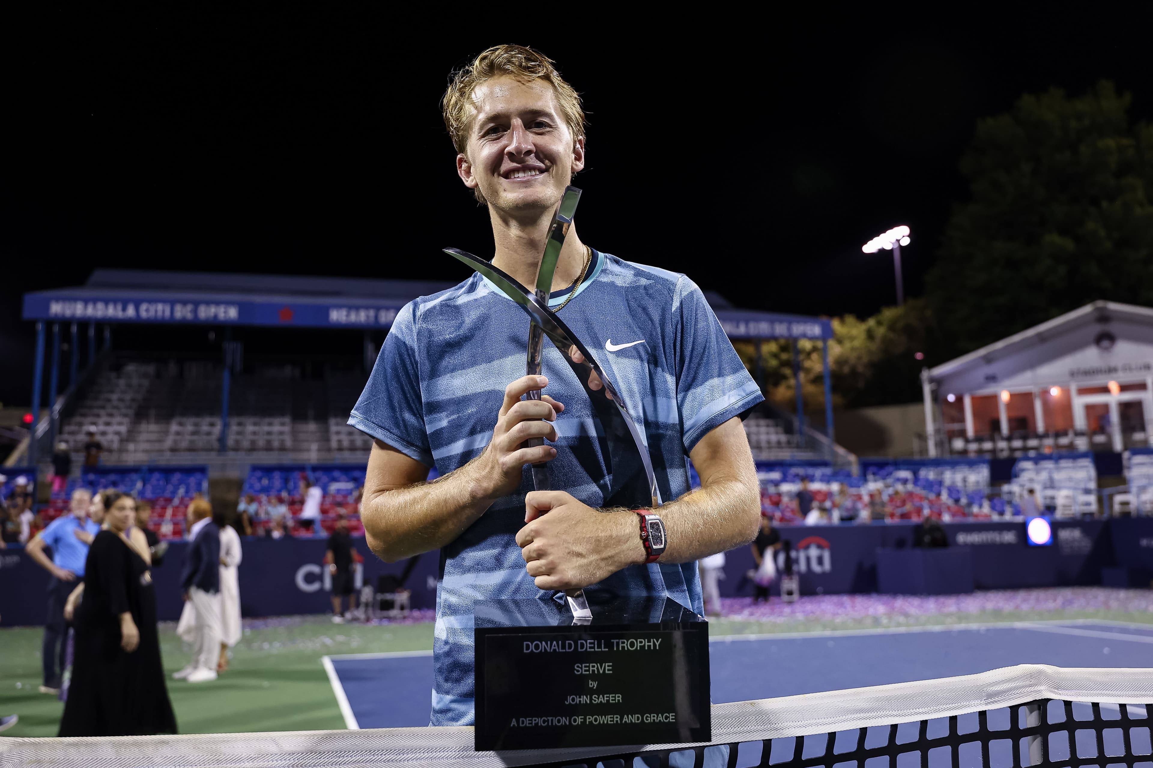 Sebastian Korda of the United States holds the Donald Dell Trophy