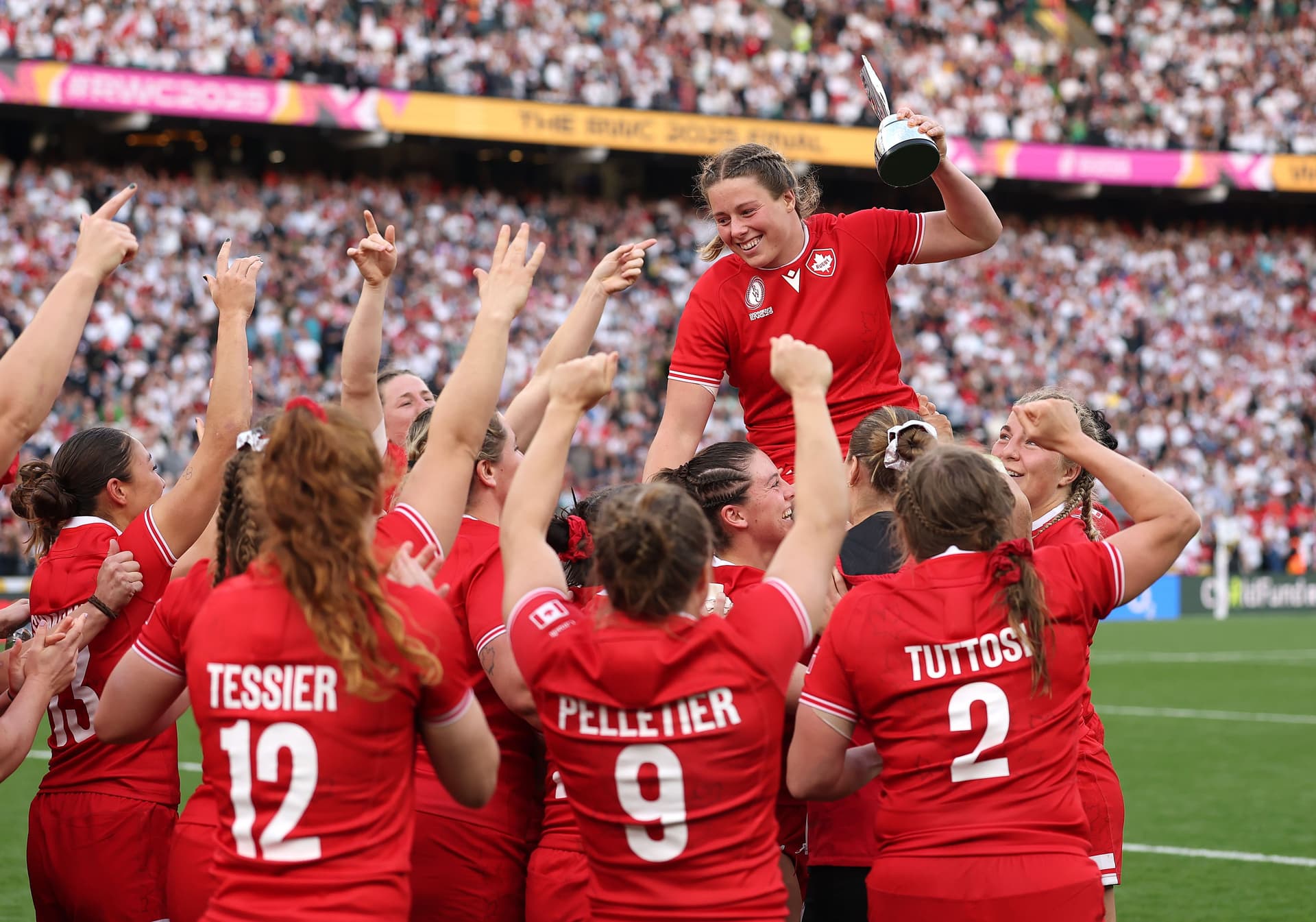 Sophie de Goede of Canada celebrates with teammates after winning the Player of the Year Trophy.jpg