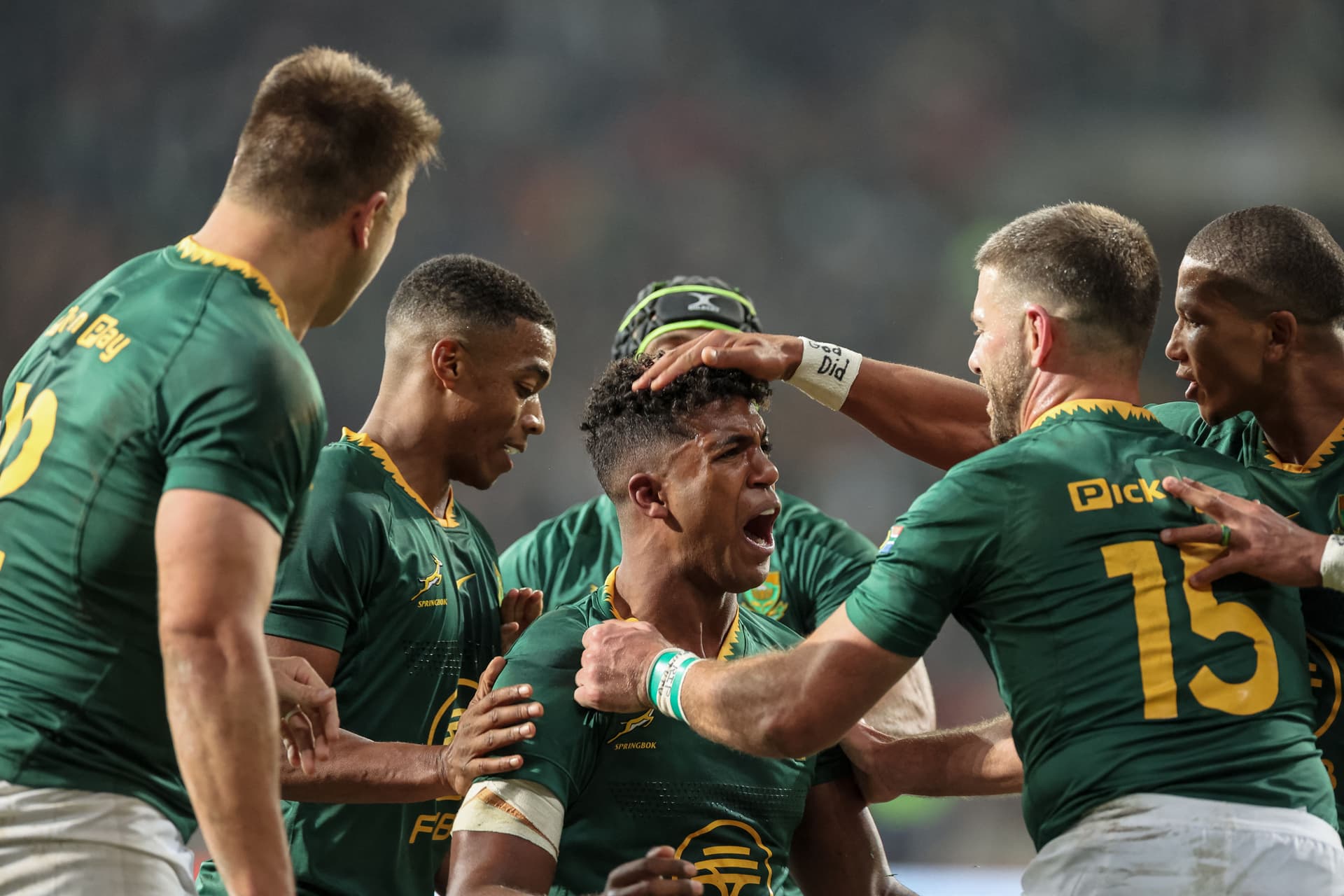 South Africa's centre Canan Moodie (C) celebrates with teammates