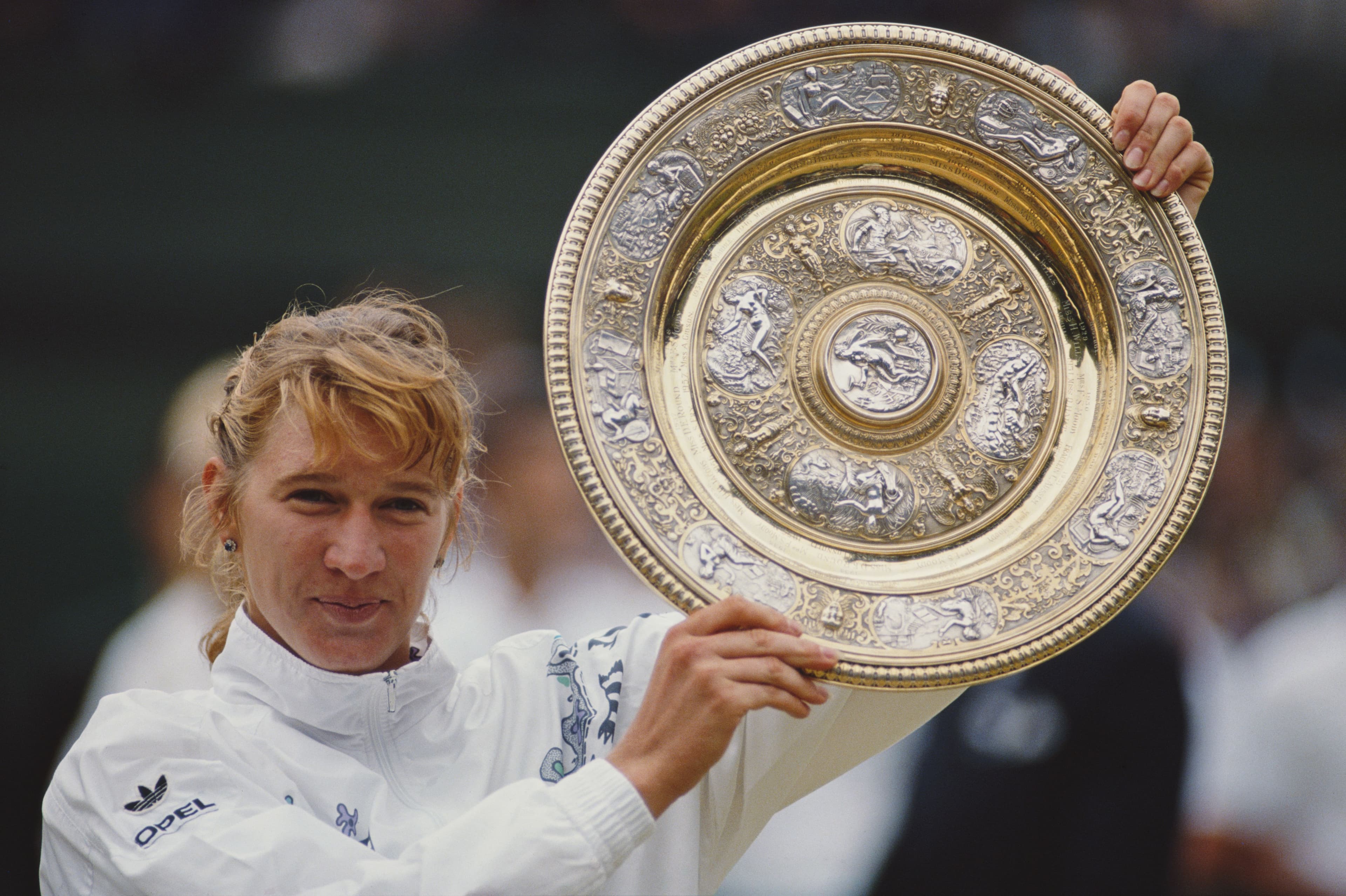 Steffi Graf of Germany holds aloft the Venus Rosewater Dish