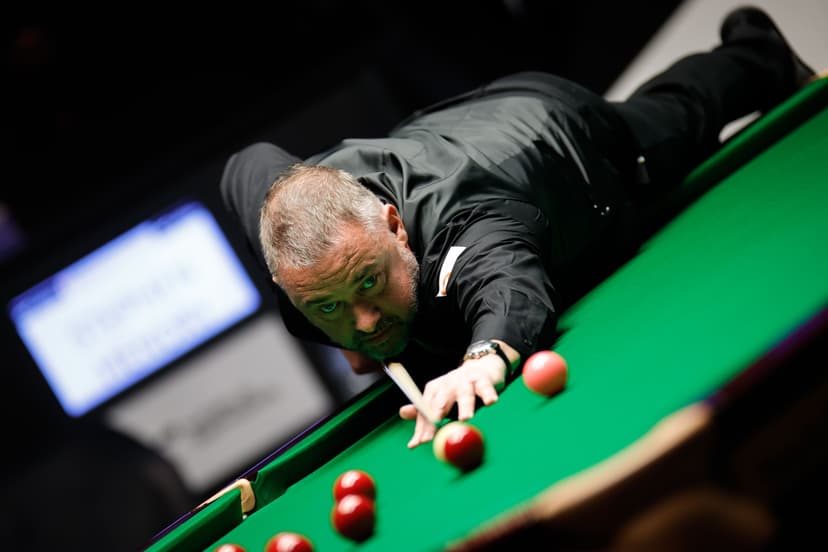 Stephen Hendry of Scotland plays a shot in the quarter-final match