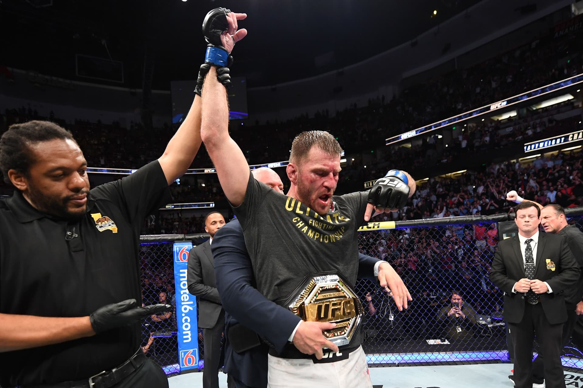 Stipe Miocic celebrates his TKO victory over Daniel Cormier