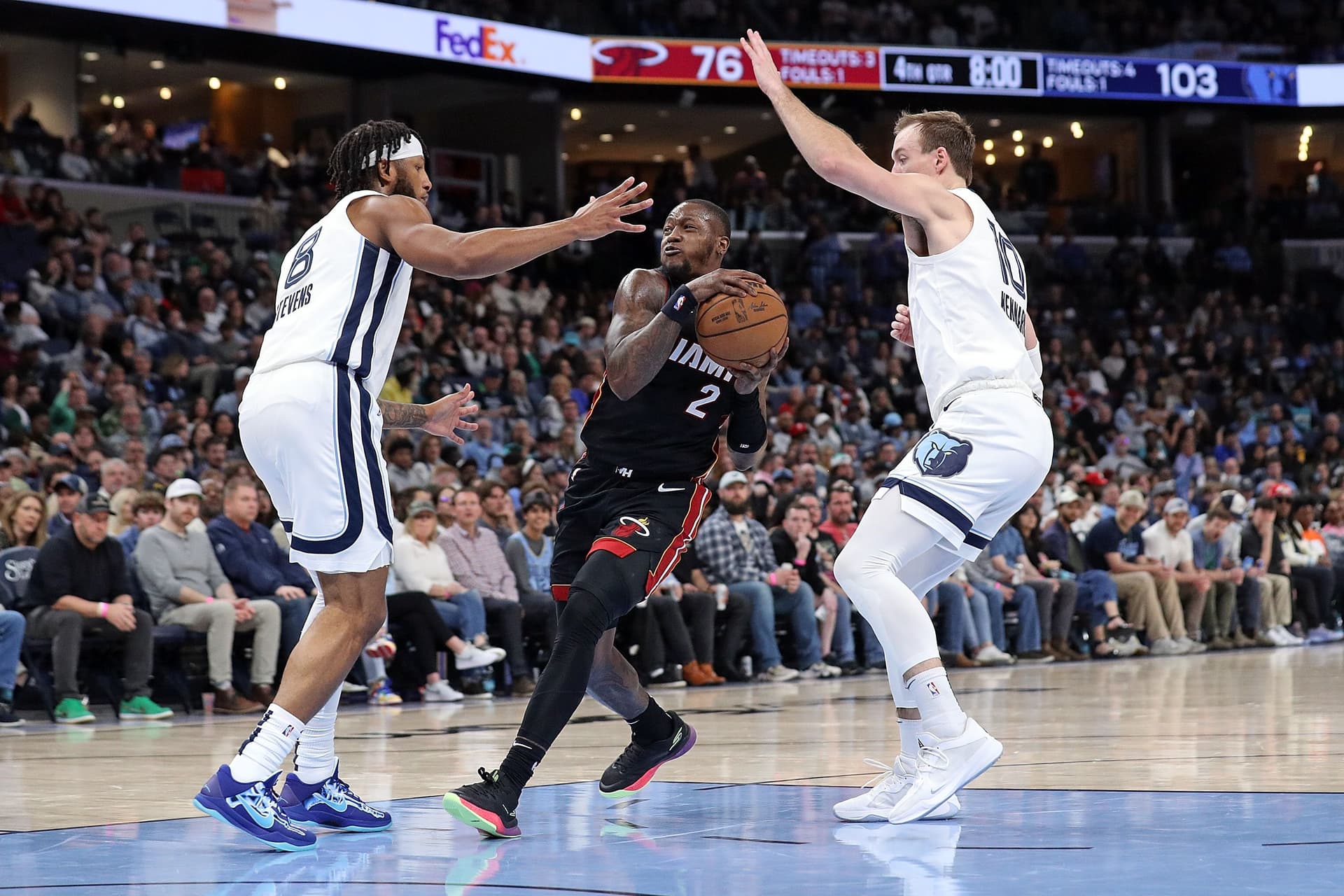 Terry Rozier #2 of the Miami Heat drives to the basket against Lamar Stevens #1 of the Memphis Grizzlies