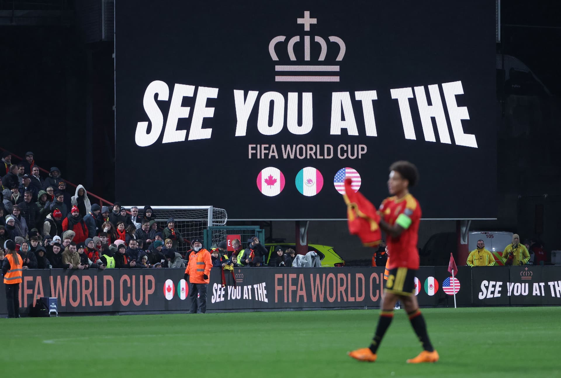 Text 'see you at the FIFA World Cup' is shown on the screen inside the stadium