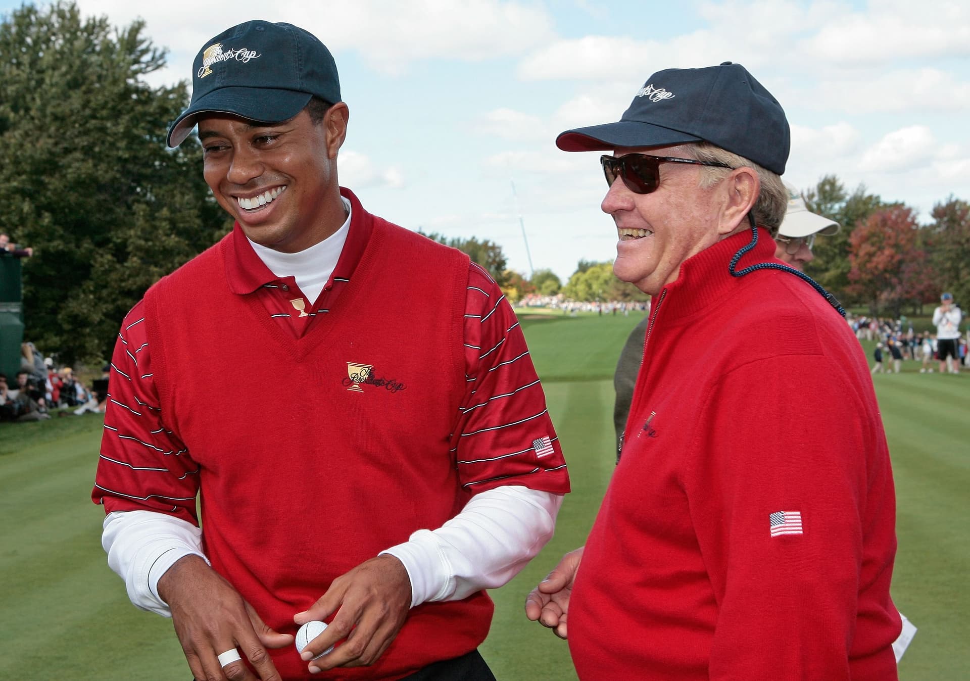 Tiger Woods of the U.S.team and Captain Jack Nicklaus share a laugh