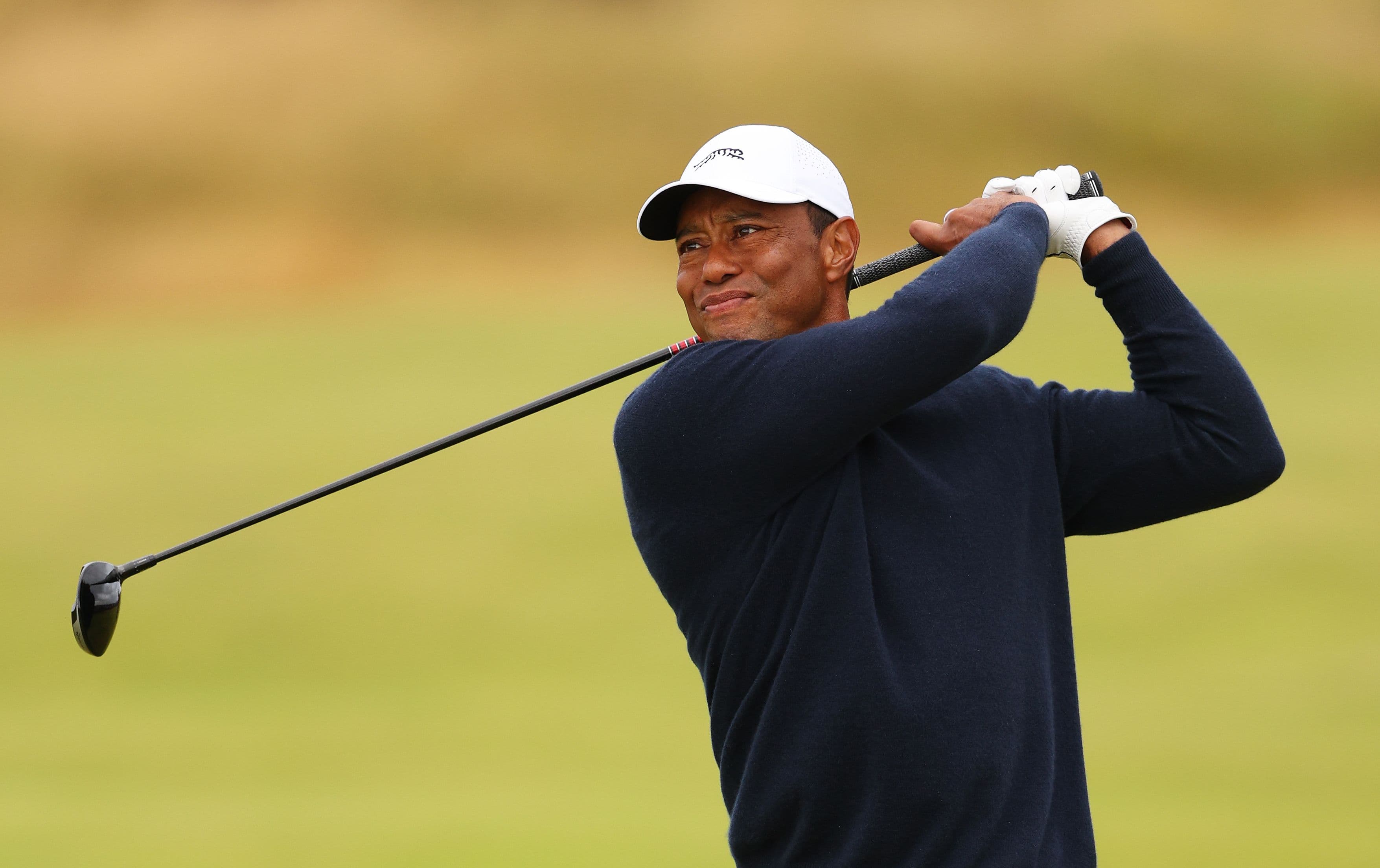 Tiger Woods of the United States plays his second shot