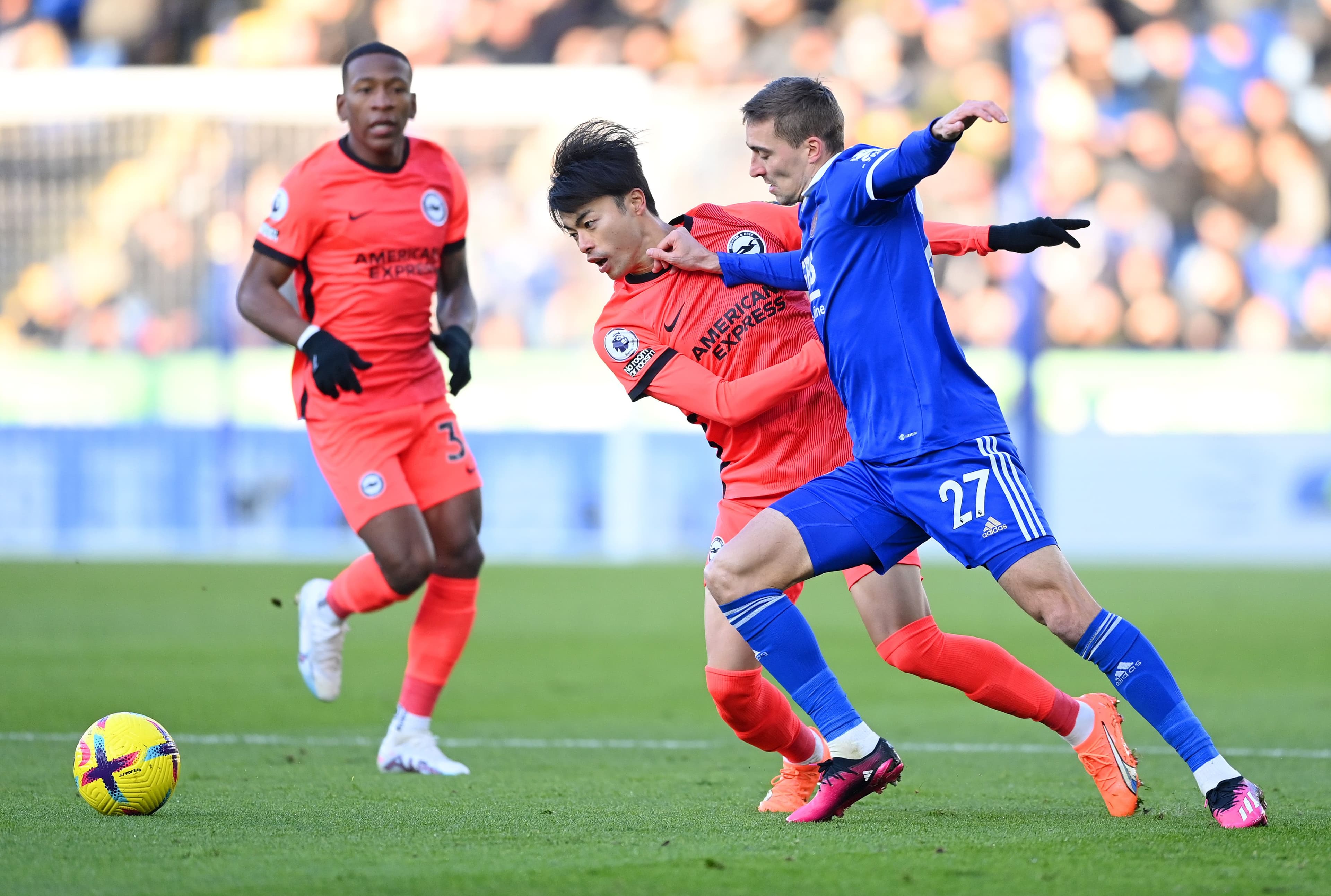 Timothy Castagne of Leicester City battles for possession with Kaoru Mitoma of Brighton & Hove Albion during the Premier League match