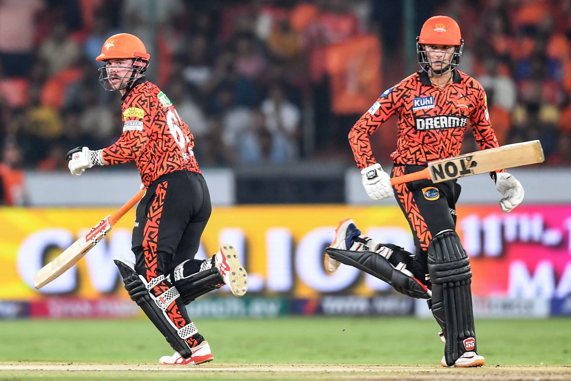 Travis Head (L) and Abhishek Sharma run between the wickets.jpg
