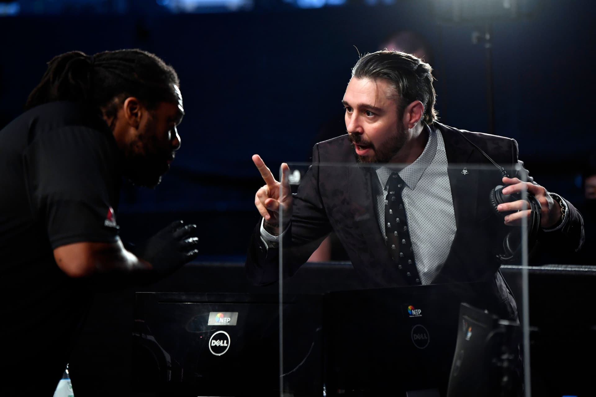 UFC fighter and analyst Dan Hardy speaks with referee Herb Dean