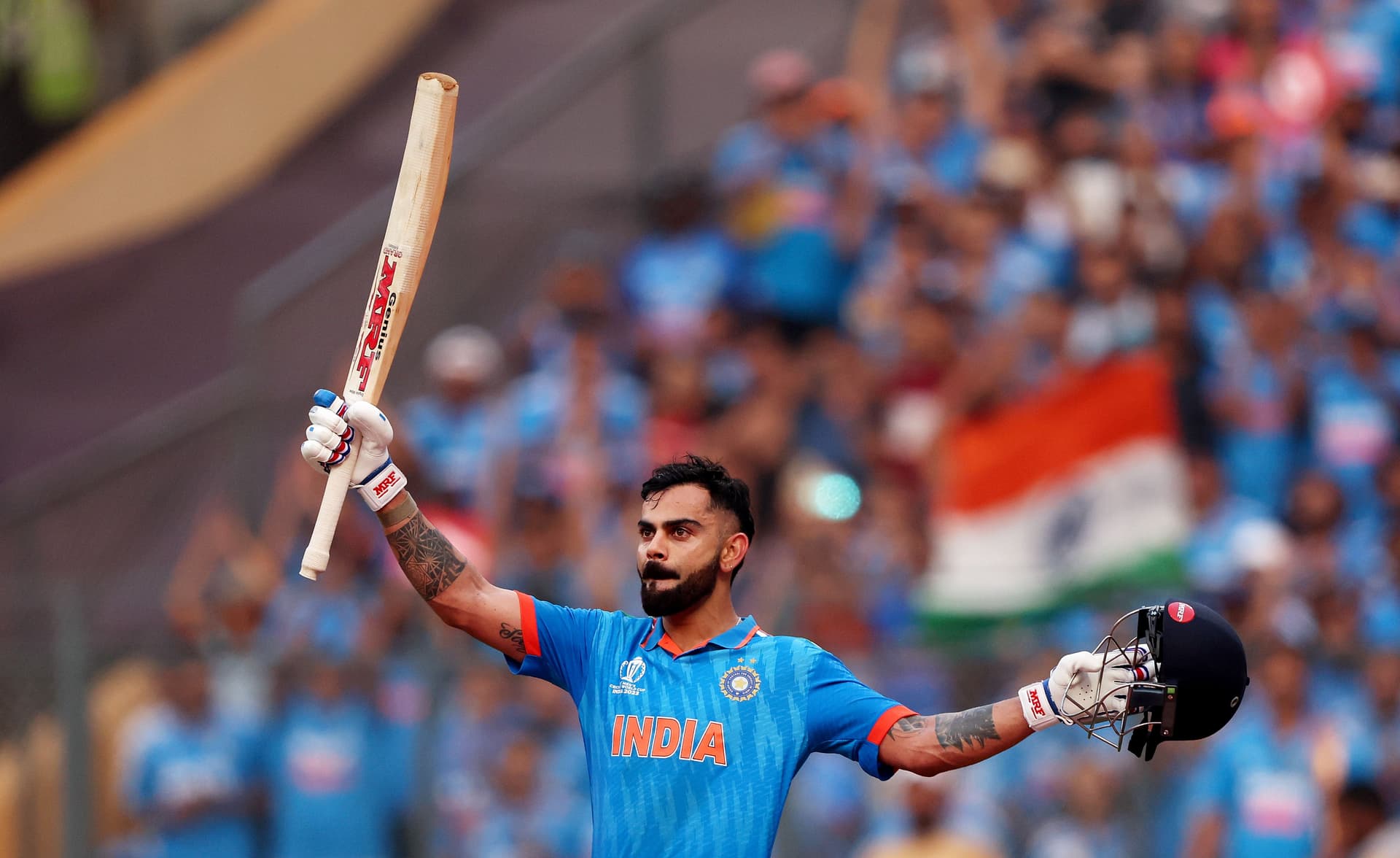 Virat Kohli of India celebrates after scoring a century