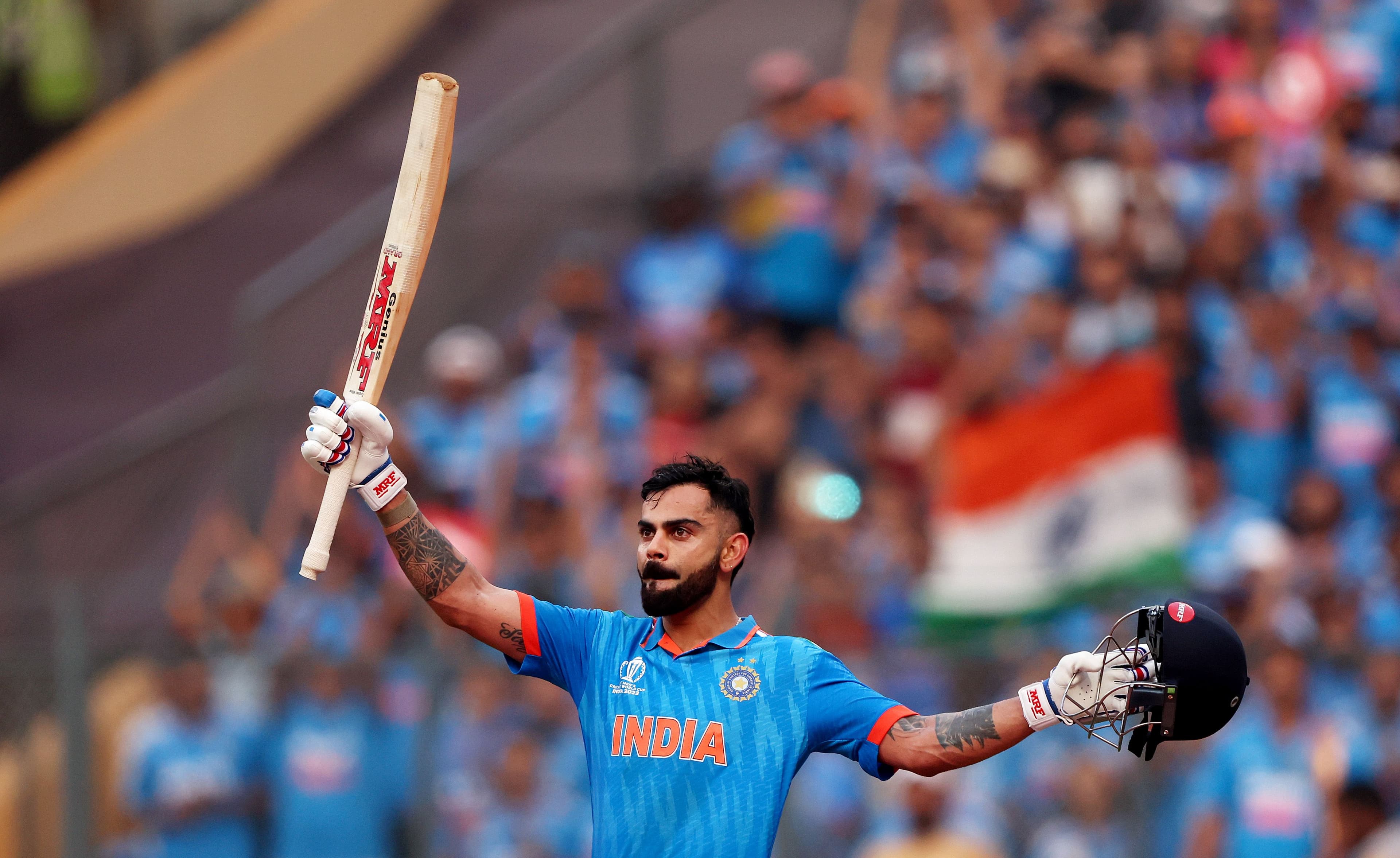 Virat Kohli of India celebrates after scoring a century