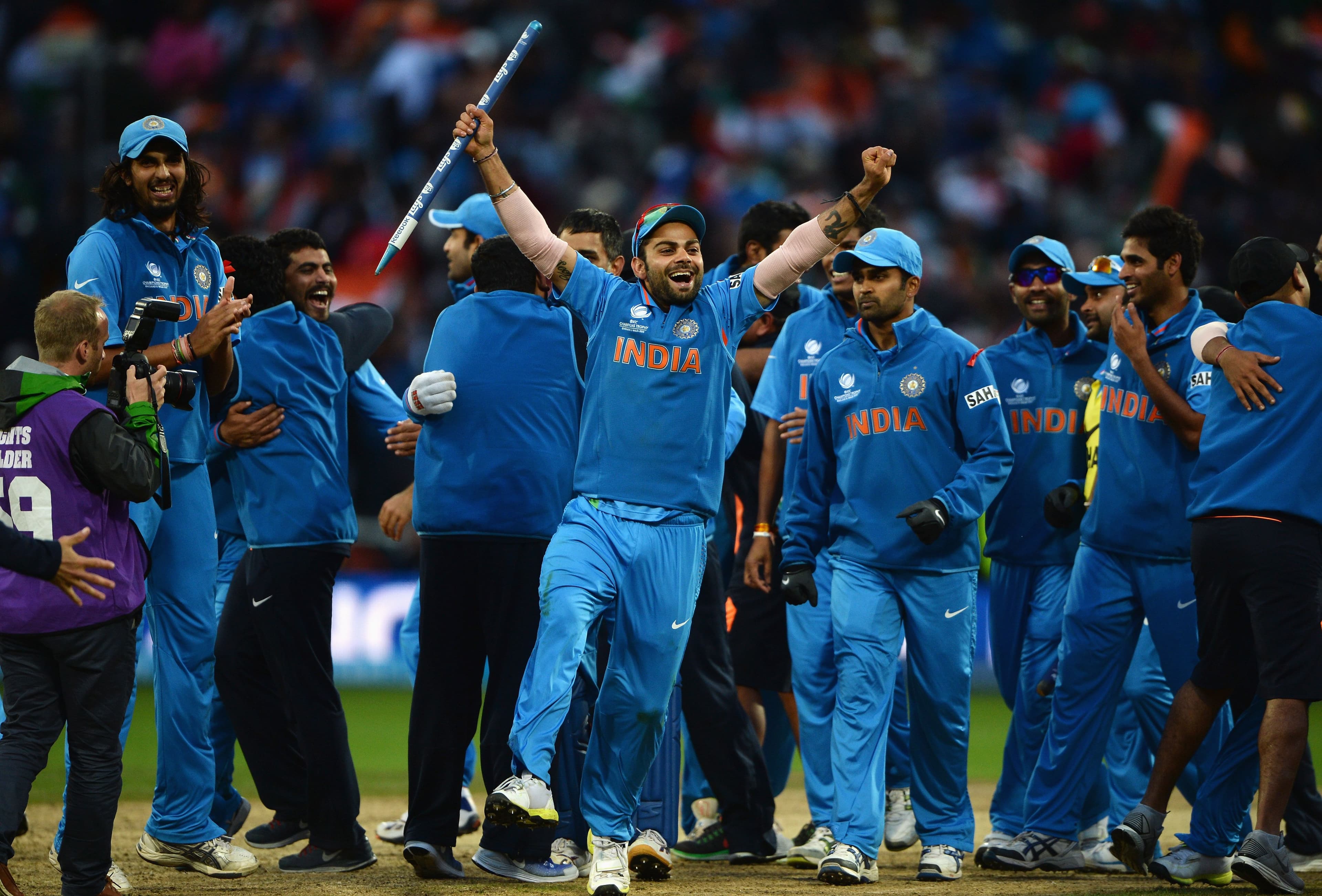 Virat Kohli of India celebrates victory with team mates