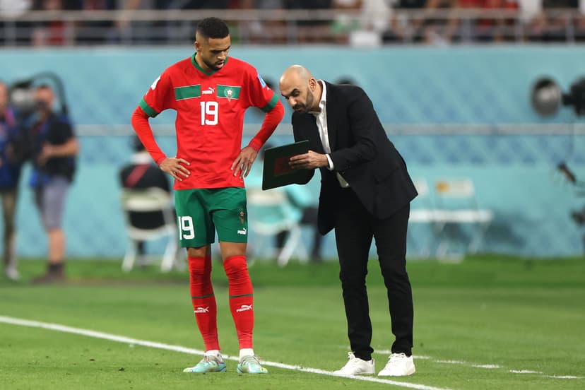 Walid Regragui, Head Coach of Morocco, speaks with Youssef En-Nesyri