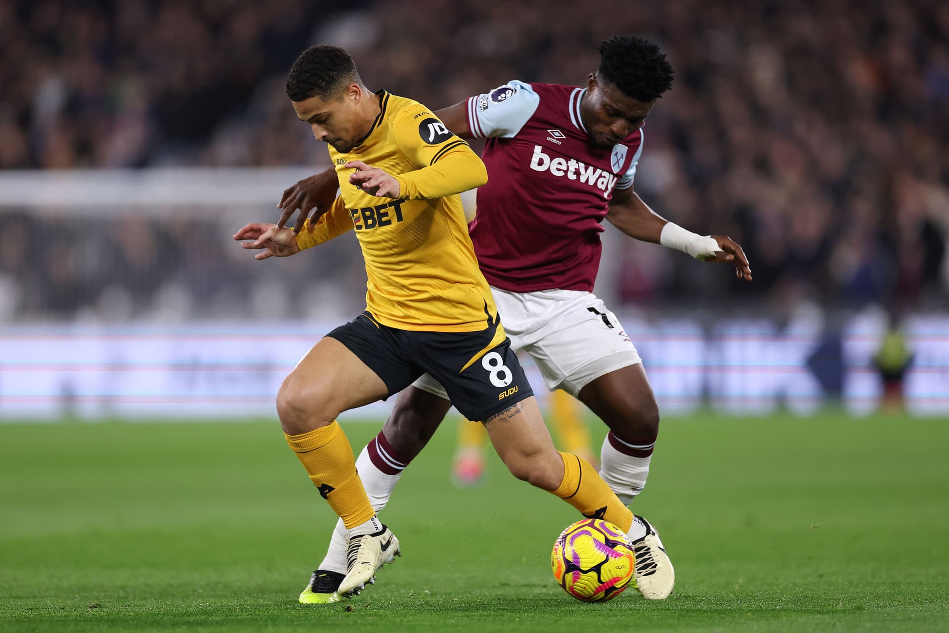 Mohammed Kudus battles for possession with Joao Gomes