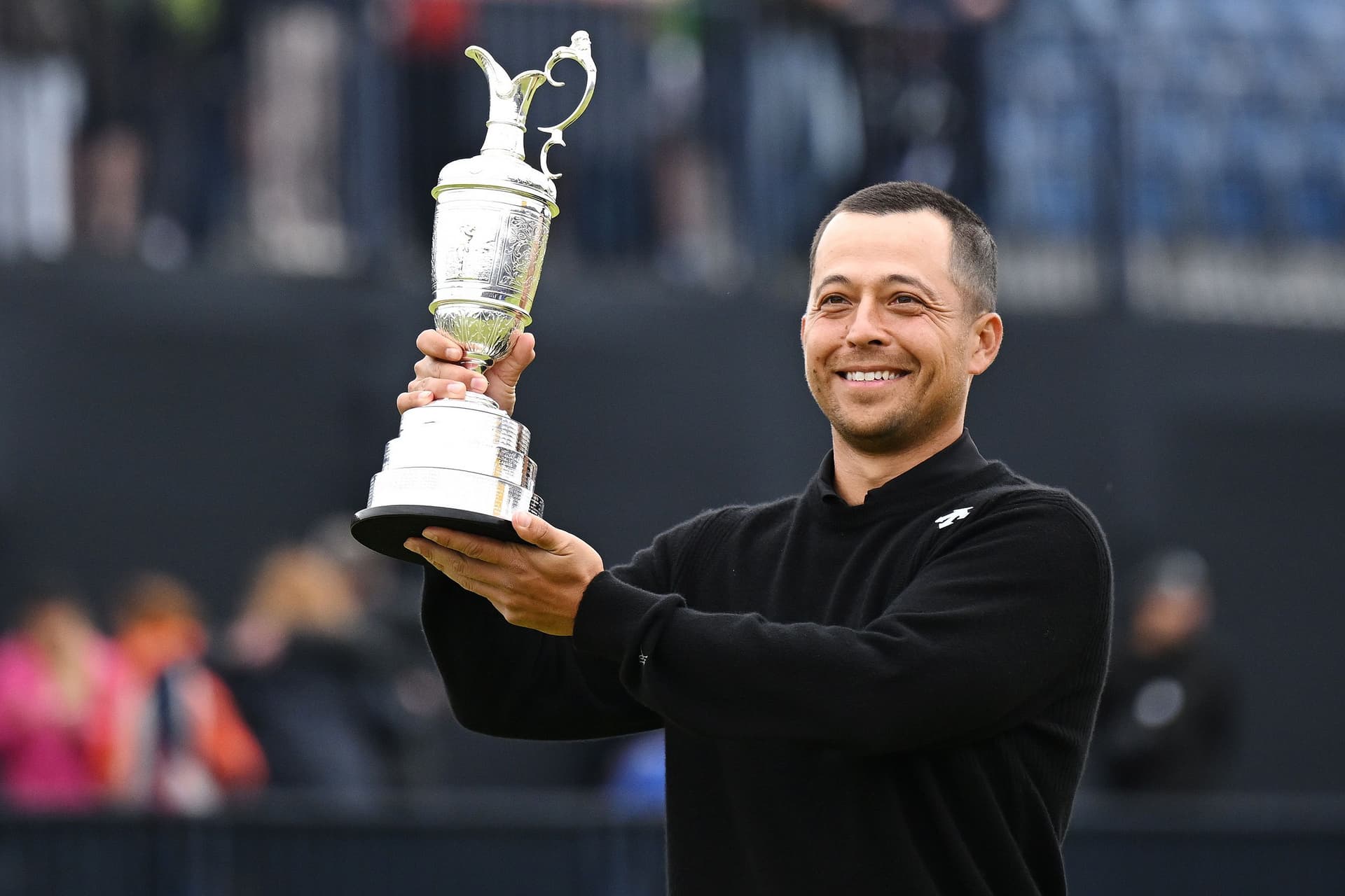Xander Schauffele of the United States lifts the Claret Jug