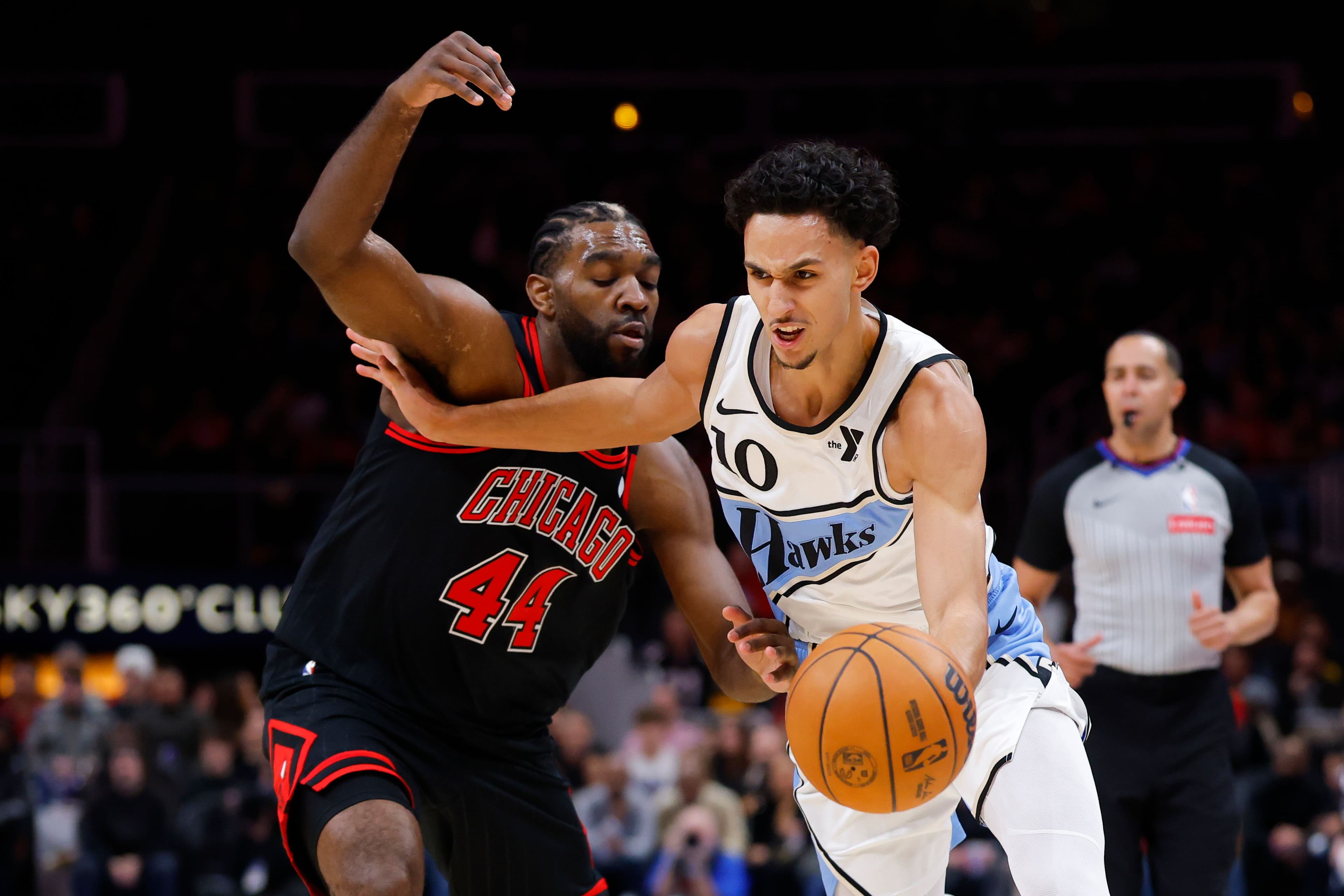 Zaccharie Risacher drives against Patrick Williams